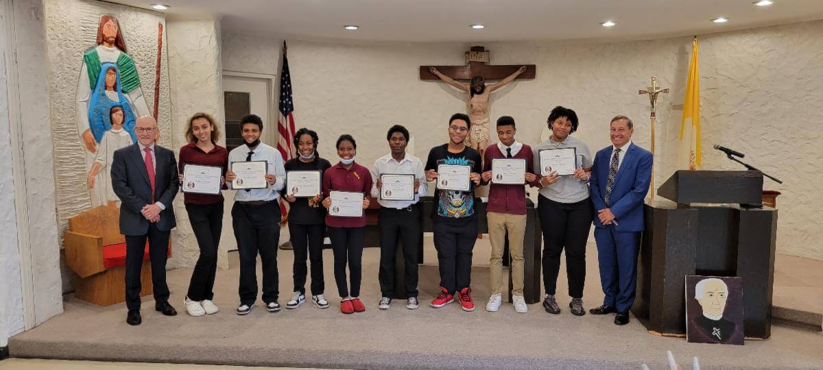 Denis Wuestman '73 and Jesus Linares '73 with the 2022 Scholarship Winners